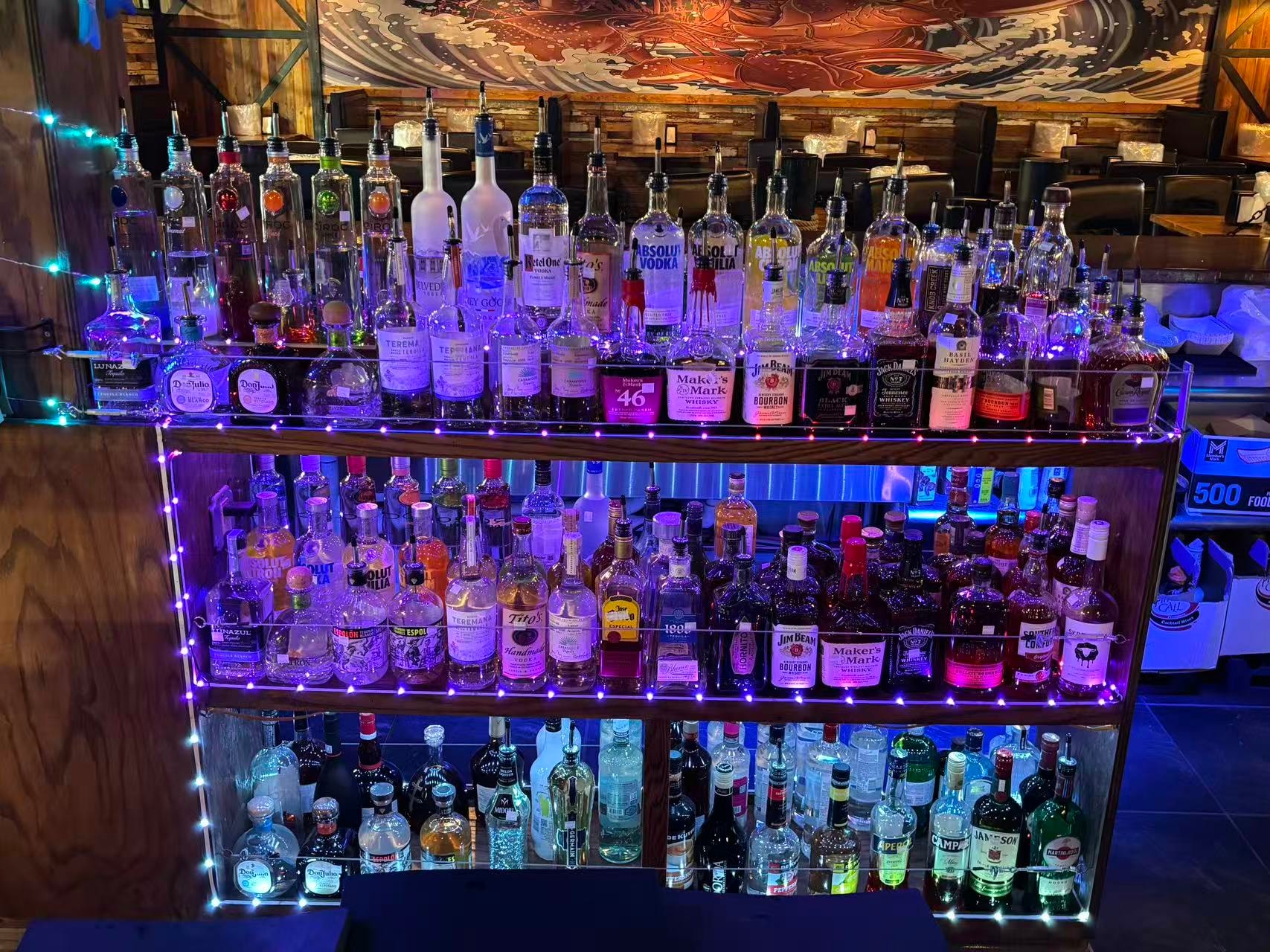 Full bar with premium spirits at Boil Bay